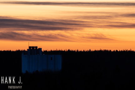 Grain silo at sunset